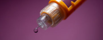 A close-up photo of an insulin syringe for type 1 diabetes treatment.