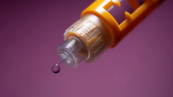 A close-up photo of an insulin syringe for type 1 diabetes treatment.