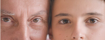 A close photo of two faces of different age.