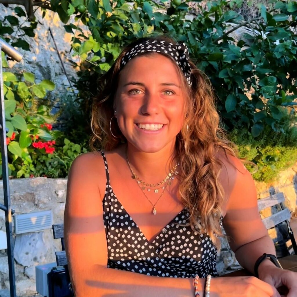 A woman smiling in the sunset