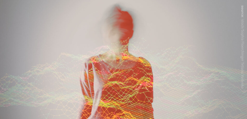 The image of a person and red-green-blue graphs infront of the person.