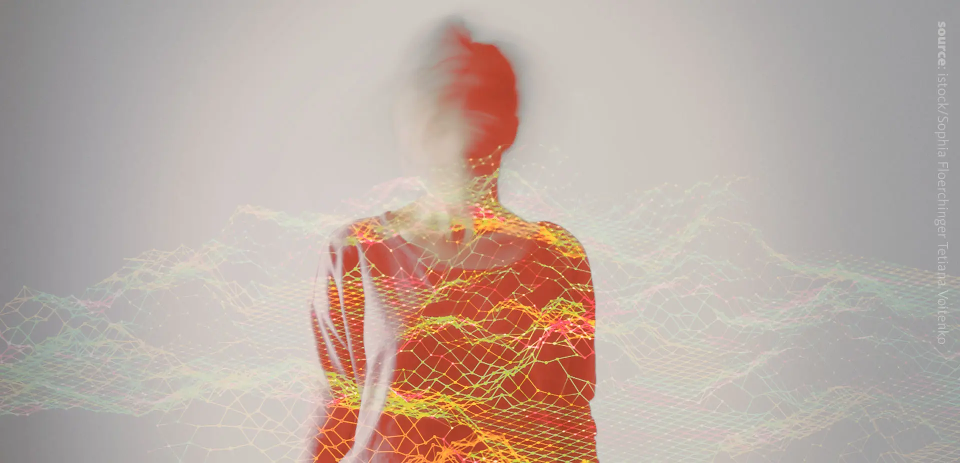 The image of a person and red-green-blue graphs infront of the person.