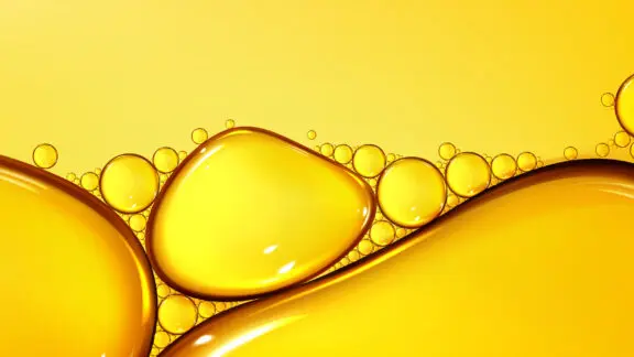 A close-up photo of oil forming droplets.