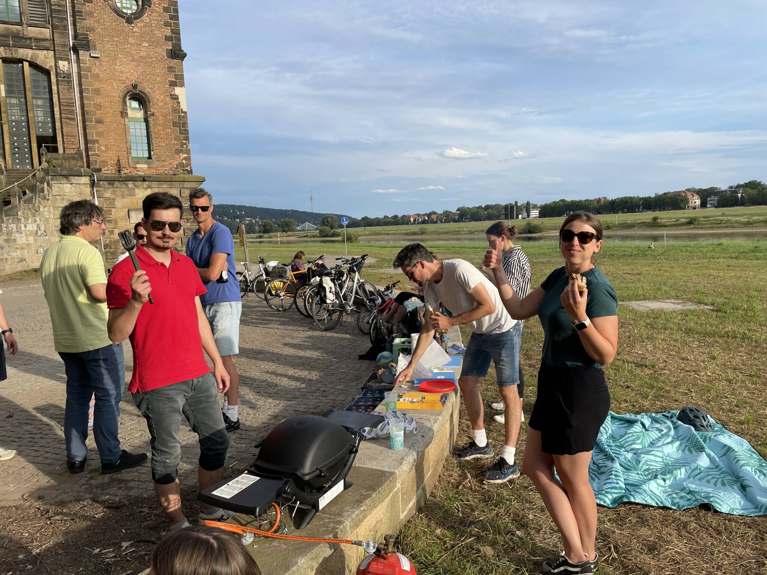 People wearing sunglasses at a barbecue 