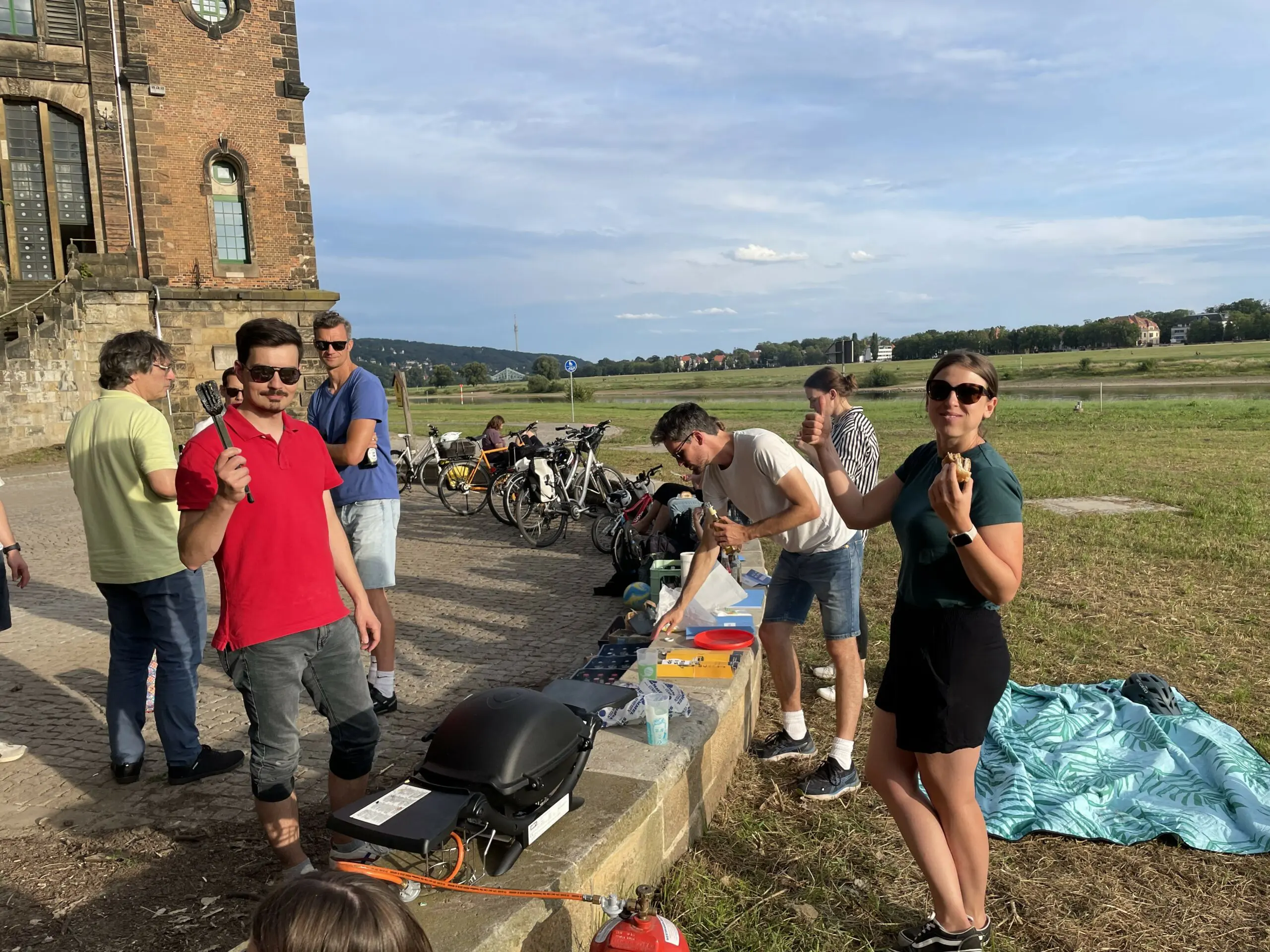 People wearing sunglasses at a barbecue